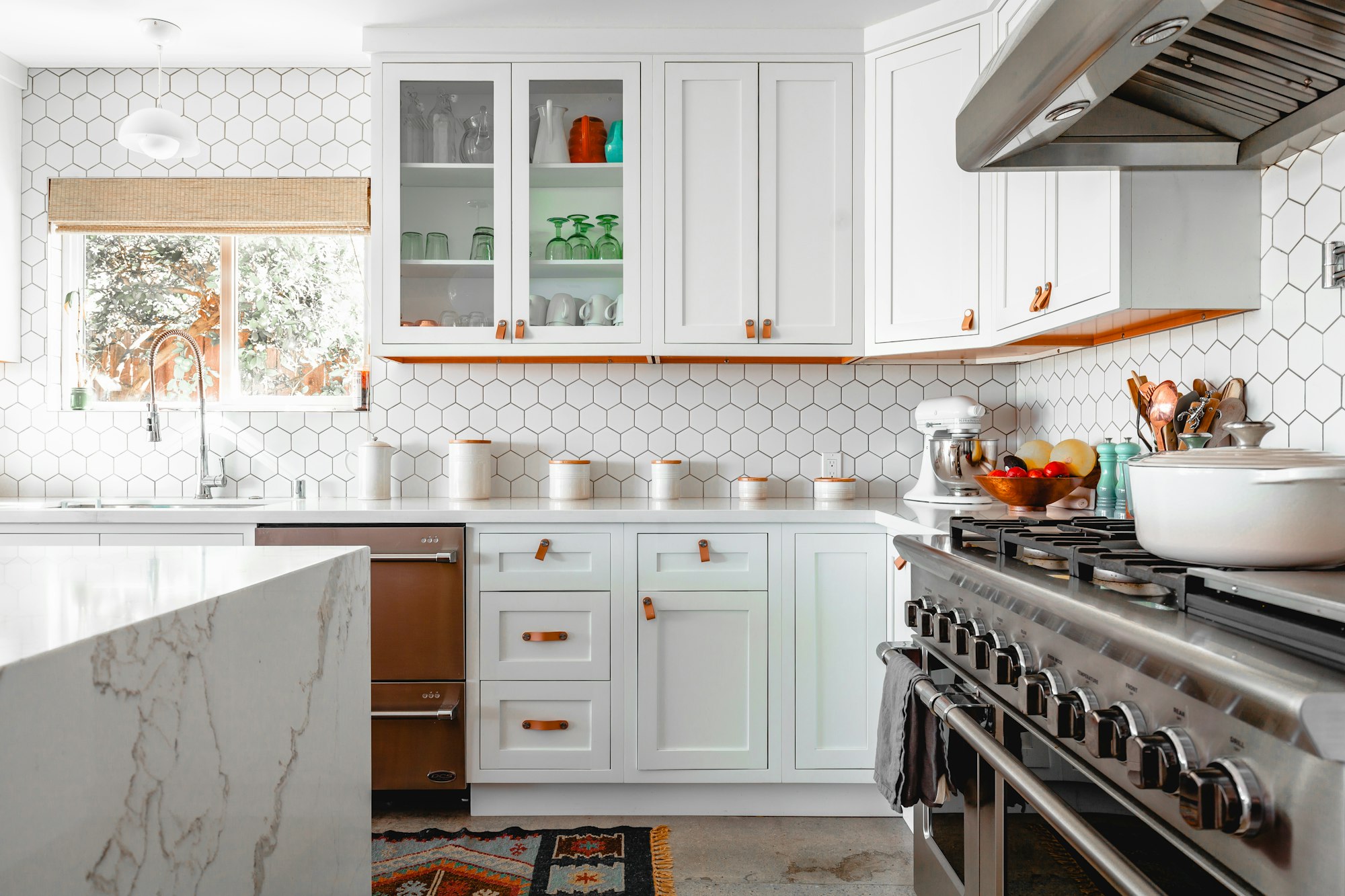 Bright white shaker kitchen with quartz island installed by Capital Solution Cabinets